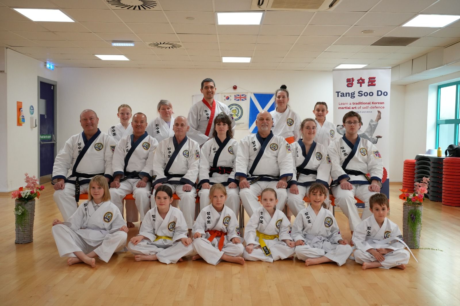 Club members of all ages together for a group photo in their uniforms.